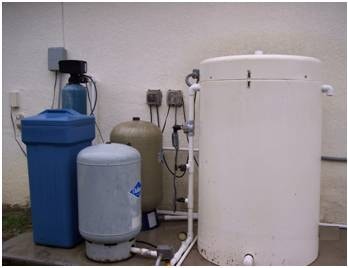 Well water treatment system with blue filter and storage tanks